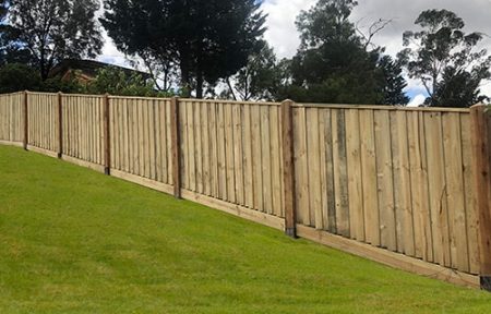 treated pine fence on hill